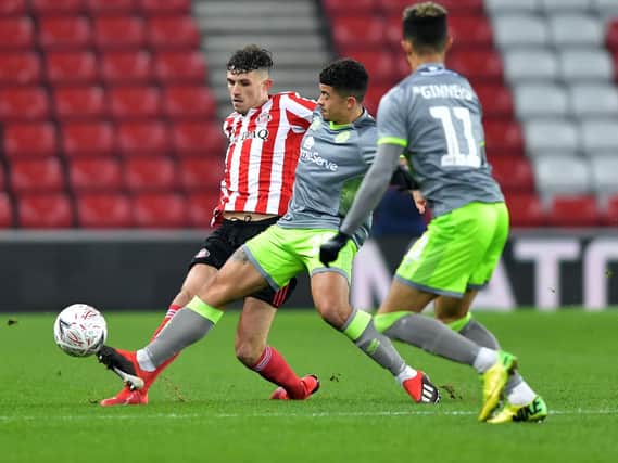 Sunderland's Tom Flanagan challenges for the ball.