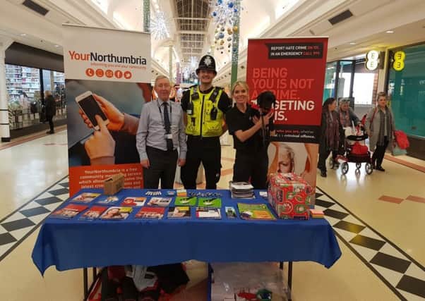 PC Chris Pennock with community engagement team members Sally College (right) and Paul Marshall (left) in the Bridges with Russell.