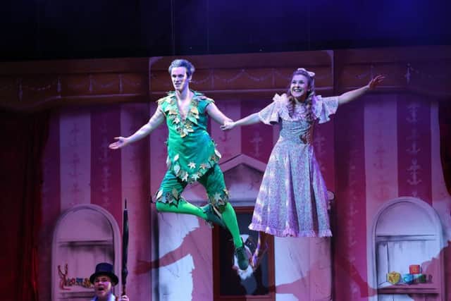 Josh Andrews flying high as Peter Pan and Ruth Betteridge as Wendy