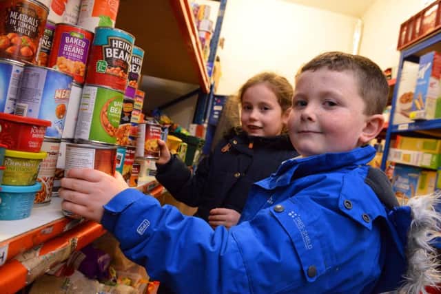 Hill View Infants children James Newton, six, and Isla Caruthers, seven, are among the children who visited the Bede Tower Global Cafe's food bank store.