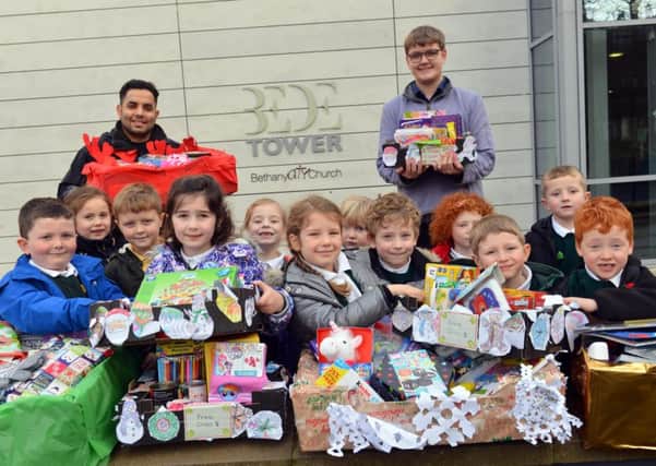 Hill View Infants made hamper donations to Bede Tower Global Cafe with refugee Miaad Hajianfar and assistant Pastor Daniel Alcock.