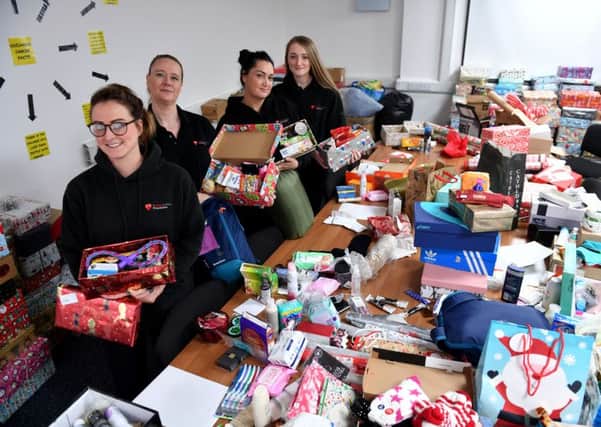 (Left to right) Jade Lowery, Lynn Murphy, Gemma Lowery and Brooke Mitchell filling Christmas Shoe boxes. Picture by FRANK REID