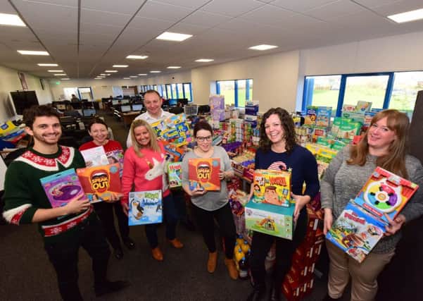 Staff at SCS hand over a huge hamper  to Wearside Women in Need at the SCS Distribution Centre in  Seaham Grange Industrial Estate. Pictured left to right Carl Randle, Sue Smith, Sandra Wales, Maurice Porteous and Sonya of SCS, with Joanne Brown and Helen Slimin of Wearside Women in Need.