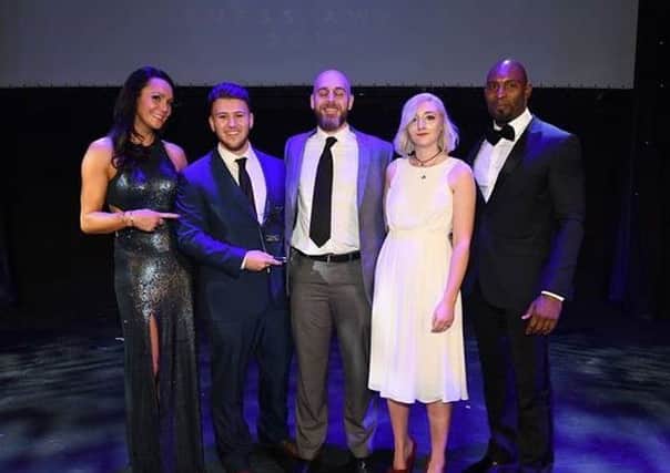 Second from left, Liam Roper, and middle, Stuart Roper, of Armageddon Fit Strength and Conditioning Academy on getting the Combat Zone Gym of the Year award.