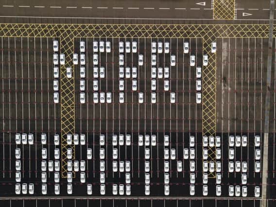 149 Nissan Jukes were parked in sequence to create this super 'Merry Christmas' message at the firm's Sunderland plant.