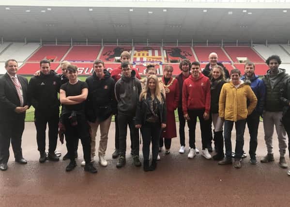 Care leavers who have been given tickets to the Sunderland AFC v Bradford City game alongside players Glenn Loovens, Bryan Oviedo and Reece James, club managing director Tony Davidson, and mayor of Sunderland Councillor Lynda Scanlan.