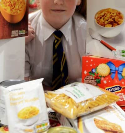 Hetton School pupil Caitlin Scott with items of food the school collected in aid of the foodbank.