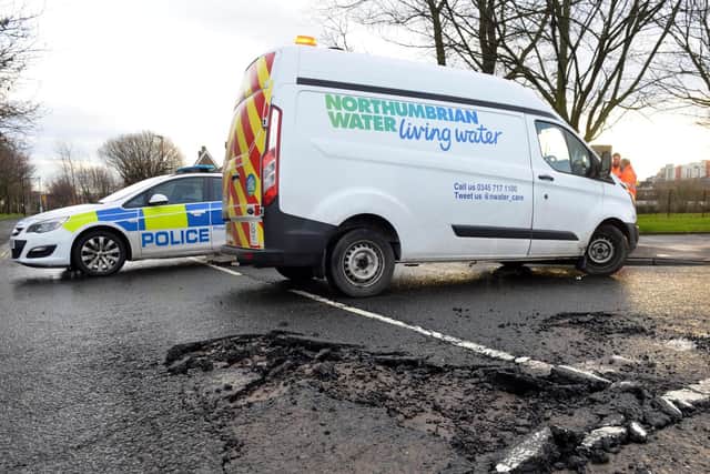 Police and Northumbrian Water vehicles at the scene of a burst water main in Sunderland.