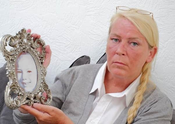 Sharon Henderson with a picture of her late daughter Nikki Allan.