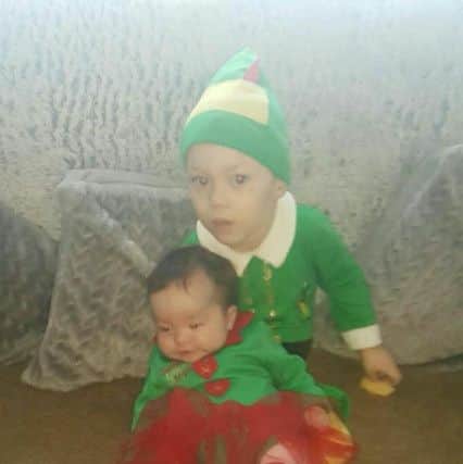 Sheldon and Violet Mae dressed as elves