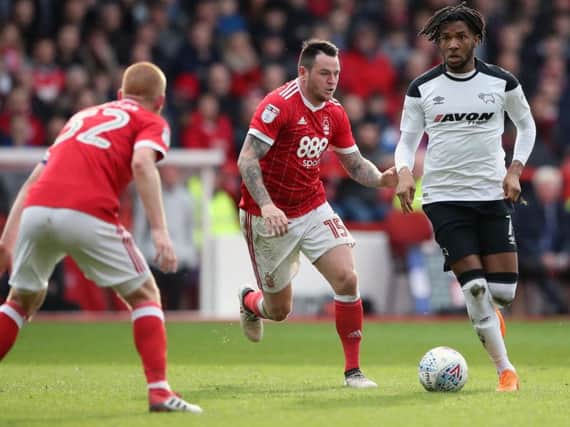 Lee Tomlin (centre) is set to join Peterborough United as the January window opens