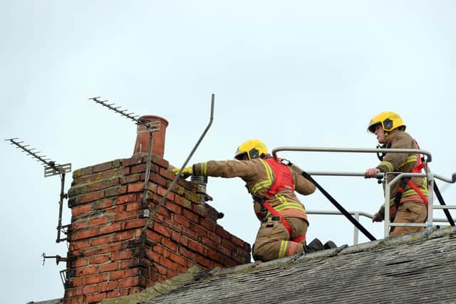 Fire crews deal with loose brickwork on a chimney in Carley Road, Sunderland.