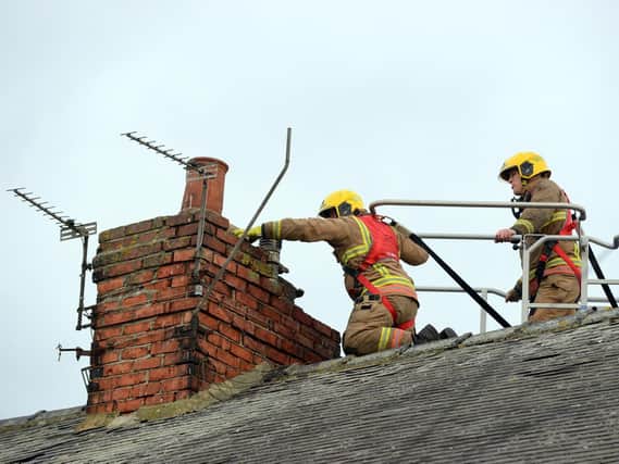 Fire crews deal with loose brickwork on a chimney in Carley Road, Sunderland.