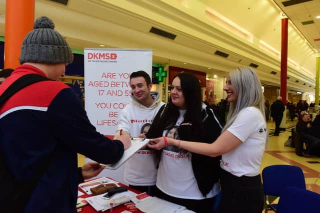 The family and friends of Chloe Gray together with DKMS Charity, asking people to sign up as potential stem cell doners, in The Brudges on Tuesday. Pictured Jason Gray, Chloe's uncle, Francesca Bowser, her mum, and nurse Danielle Hardy.
