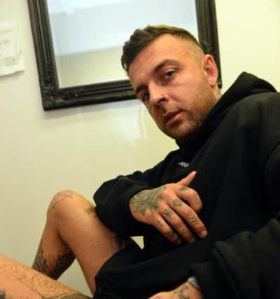Josh Cliff, the brother of Amber Rose Cliff, getting tattooed during the cervical cancer awareness tattoo event at  Joe Graham's Tattoo Studio to raise funds for Amber's Law.