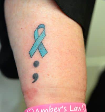 Many of those taking part in the cervical cancer awareness tattoo event got a tattoo of the teal cervical cancer ribbon to raise funds for Amber's Law.