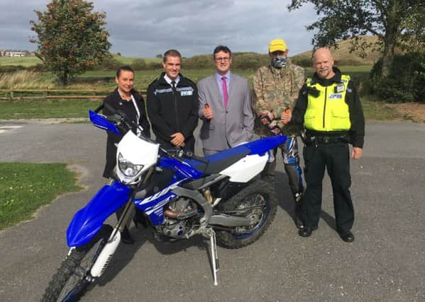 Tackling motorbike disorder are, from left, principal policy officer for people & neighbourhoods at Sunderland City Council Michelle Coates, Superintendent Barrie Joisce, deputy leader of Sunderland City Council Coun Michael Mordey, and rider and Sergeant David Stobbs.