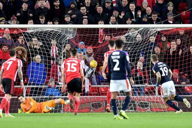 A controversial penalty secured a point for Luton Town at the Stadium of Light