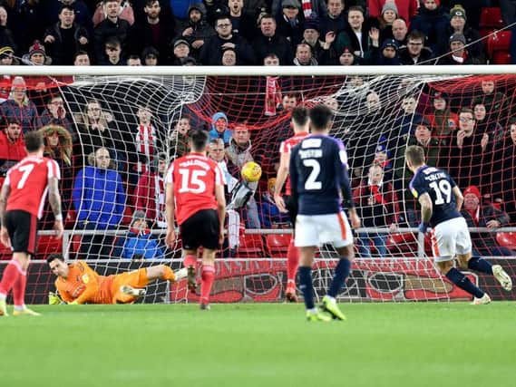 A controversial penalty secured a point for Luton Town at the Stadium of Light