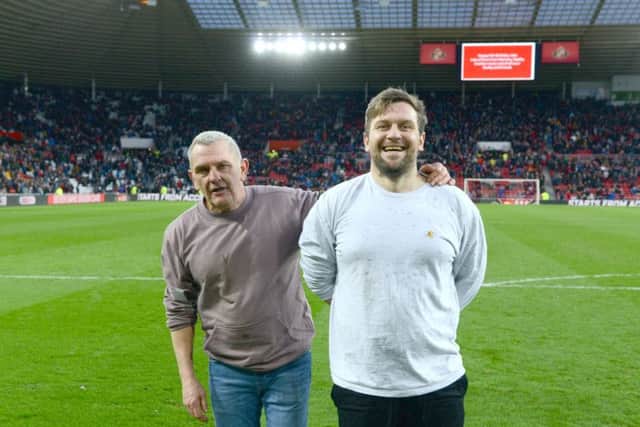 Dad Ralphy Lane with son Iain Lane at the Stadium of Light after taking part in the half-time entertainment challenge. Photo by SAFC club photographer Alan Hewson.