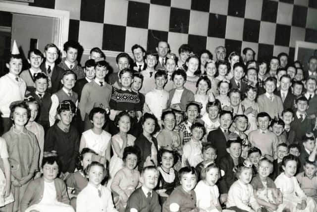 They were all ready to watch Uncle Bill in the 1950s.  Can anyone recognise themselves in the shot and what was the venue?