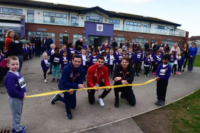 SAFC manager Jack Ross with players Reece James and Glenn Loovens during their visit to St Joseph's RC Primary School, Rutland Street, Sunderland, to launch the school's Daily Mile track.