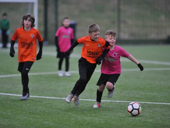 Russell Foster under 10s football action between Peterlee Helford, orange, and Washington Athletic Samba, played at Silksworth Sports Complex, Sunderland.