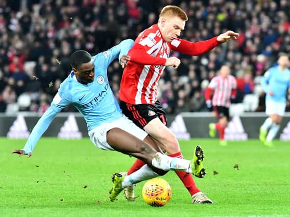 Duncan Watmore battles for possession against Manchester City Under-21s in the Checkatrade Trophy.