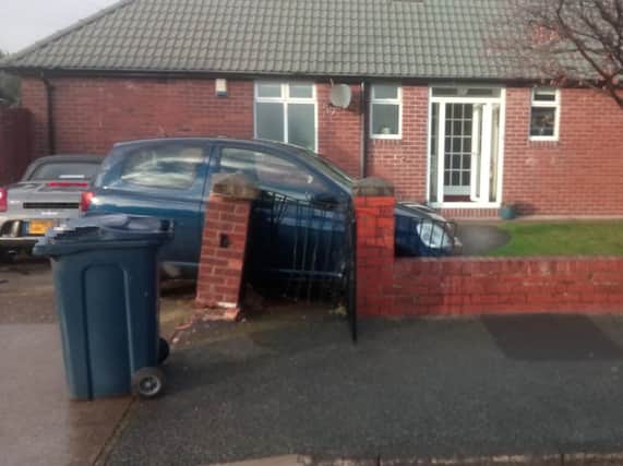 A Toyota Yaris car which has crashed into the wall of a house in Wearmouth Drive, Sunderland.