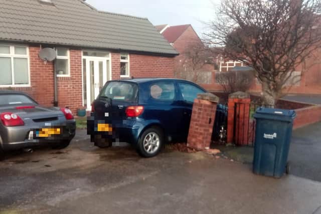 A Toyota Yaris car which has crashed into the wall of a house in Wearmouth Drive, Sunderland.