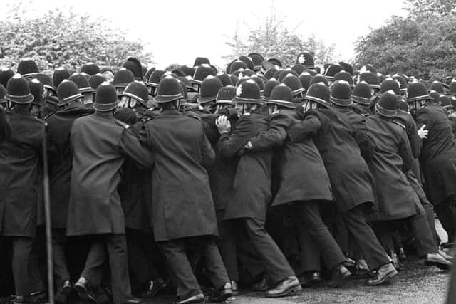 Police officers pushing against striking miners outside the Orgreave Coking Plant near Rotherham. Their tactics have increasingly come under scrutiny.