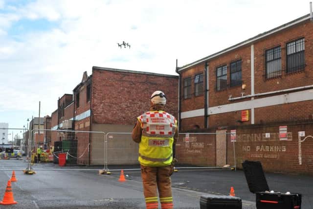 Firefighters will use a drone to help establish what caused the fire at Peacocks in Blandford Street.