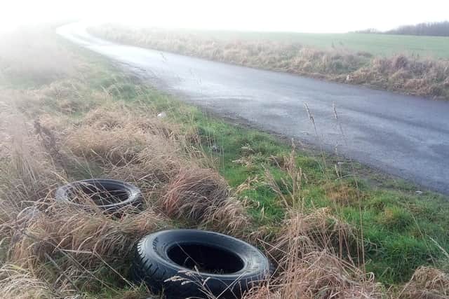 A couple of tyres remain at the side of the road