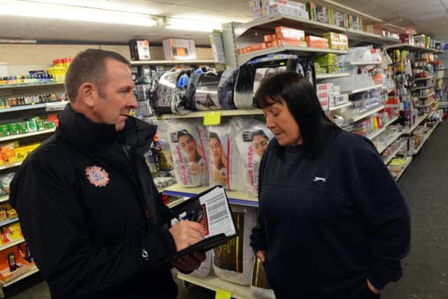 Dave Smith of Tyne and Wear Fire and Rescue Service with Kay Robe, of Homestore in Blandford Street.