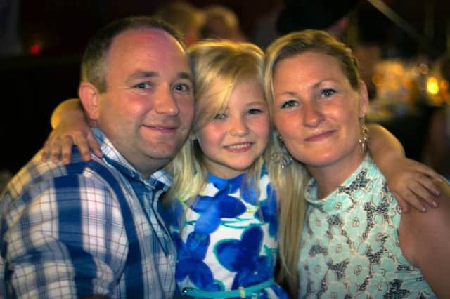 Becky Timby with her partner Brian Priest and their daughter Brooke.