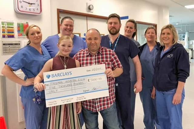 Brian Priest and daughter Brooke present a cheque for £5,000 to the Freeman Hospital in Newcastle in memory of Becky Timby, Brian's partner and Brooke's mum.
