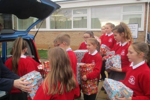 St John Bosco School pupils with the Christmas gifts they have donated.