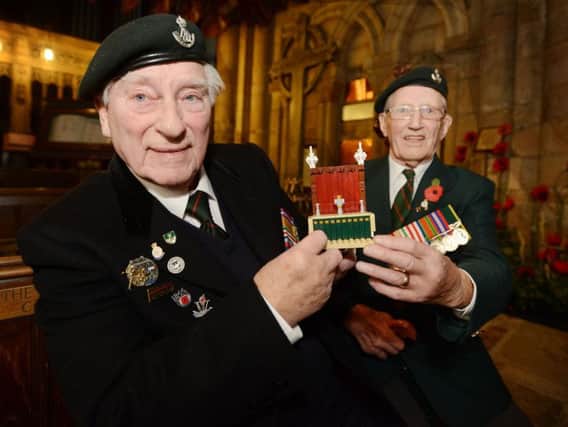Charles Eagles, left, and Dicky Atkinson, from the Durham Light Infantry Association, visit Durham Cathedral to help build a Lego replica in 2014.