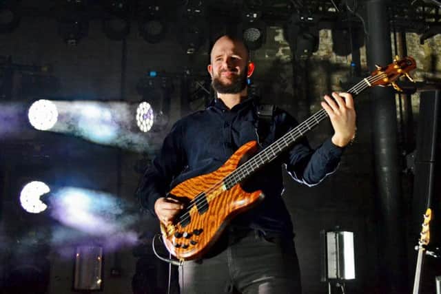 White Lies bass player Charles Cave performing at the Boiler Shop in Newcastle on the Five tour.