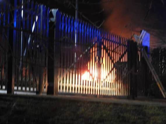 The fire as seen from beyond the locked gates at the Havelock Civic Buildings.