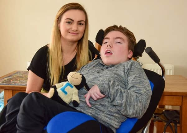 Craig Rennoldson, from Seaham, with sister Anna Henry, who together with the rest of the family are trying to raise £25,000 to build a ground floor extention, to save Craig's parents having to carry him upstairs.