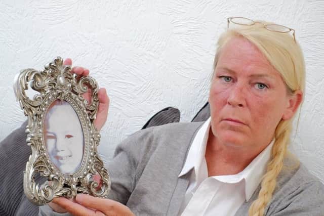 Sharon Henderson with a picture of her murdered daughter Nikki Allan.