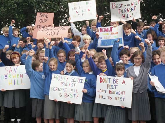 East Herrington Primary School pupils with placards protesting against the closure of Derwent Hill Outward Bound Centre, in the Lake District, in February 1995.