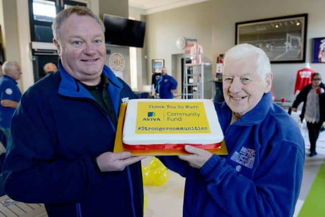 Michael Ganley (48) founder of The Fans Museum (left) celebrates with volunteer Wilf Childs (82). Picture by FRANK REID