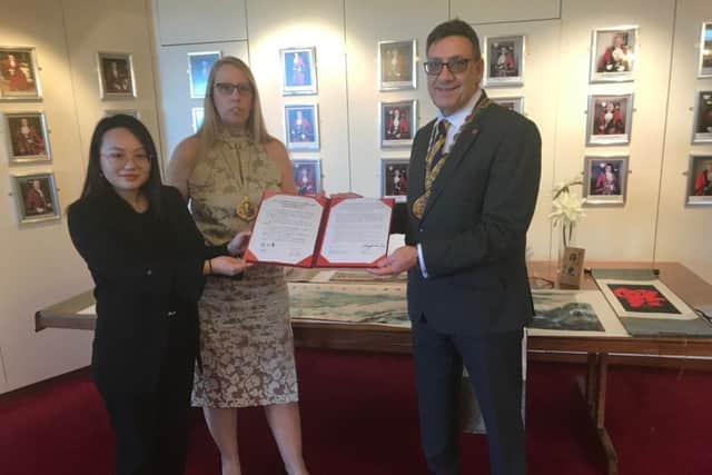 The Deputy Mayor and Deputy Mayoress of Sunderland, Coun David Snowdon and Coun Diane Snowdon, with Miss Jiang Yuxin with a small replica copy of the signed Friendship Agreement