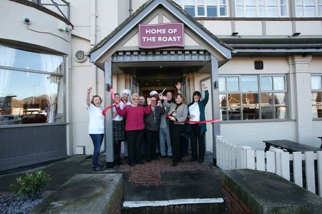 Mayor of Sunderland Lynda Scanlan and staff from St Benedict's Hospice cutting the ribbon at Barnes Carvery