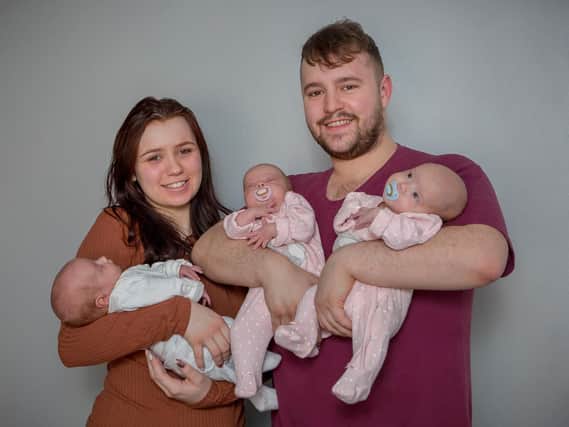 Chloe Bates and Dylon Freeman with their new triplets Jaxon, Alana and Aria.