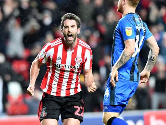 Will Grigg celebrates his first goal in a Sunderland shirt