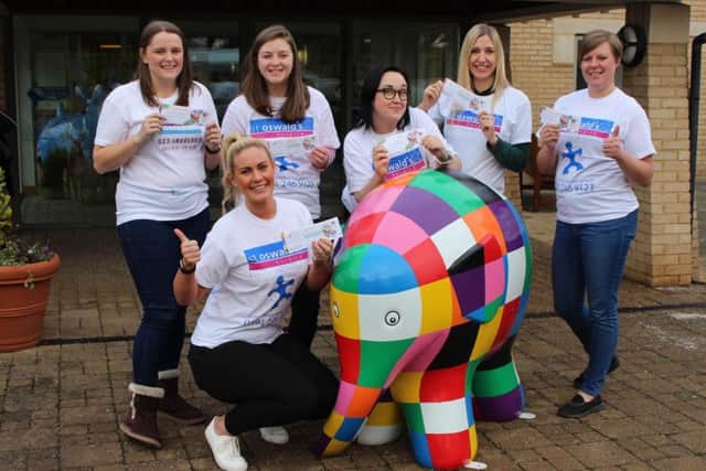 Elmer the elephant with members of the fundraising team from St Oswald's Hospice.