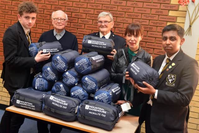 St Aidan's Catholic Academy present sleeping bags to Churches Together for the homeless members Father Alec Barrass, Cherry Hanson and Bev Ashton.